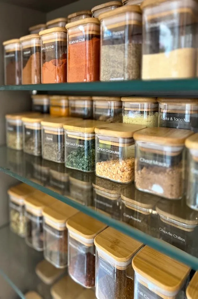 Rows of decanted dry goods in matching jars.