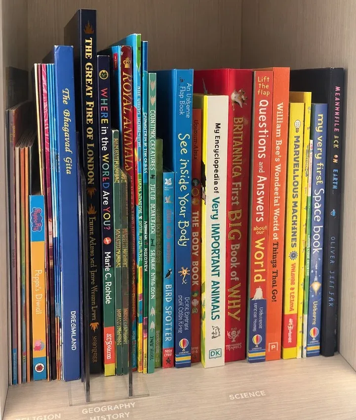 Children's books shelved upright, spines out.