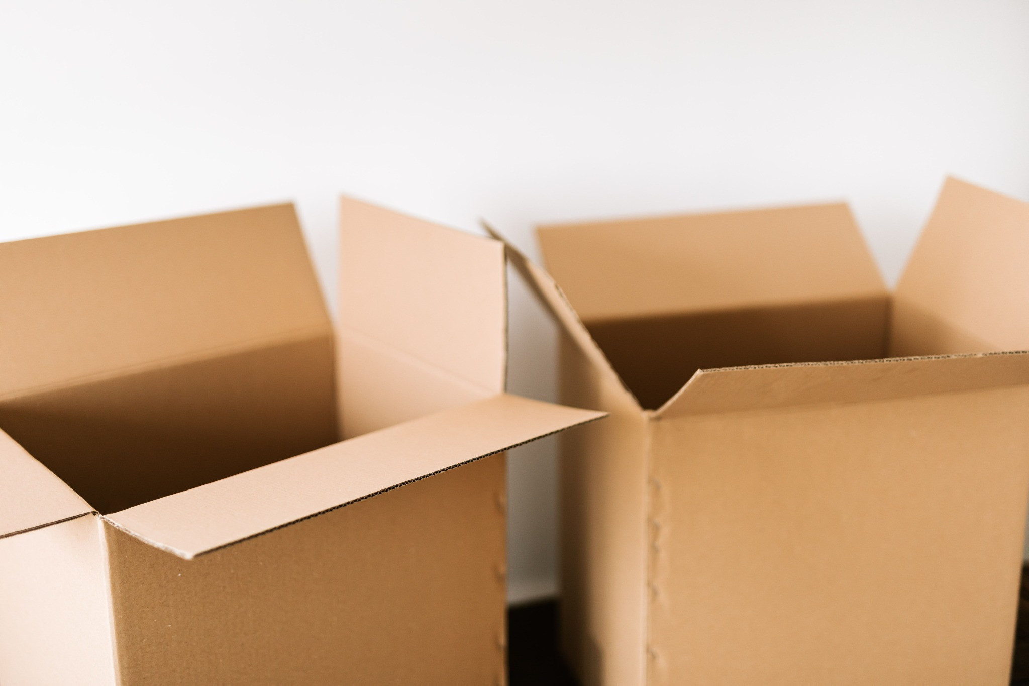 Open cardboard boxes, ready to be unpacked.